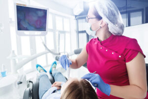 Dentist using a intraoral camera on a patient.